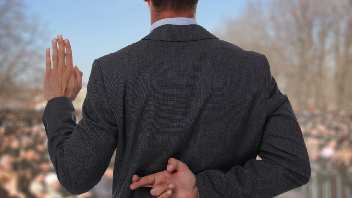 Politician liar gives people impossible promises with fingers crossed on his back.