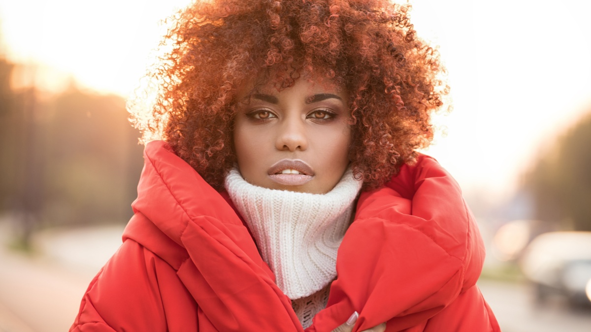 Autumn outdoor portrait of beautiful african american girl with afro hairstyle.