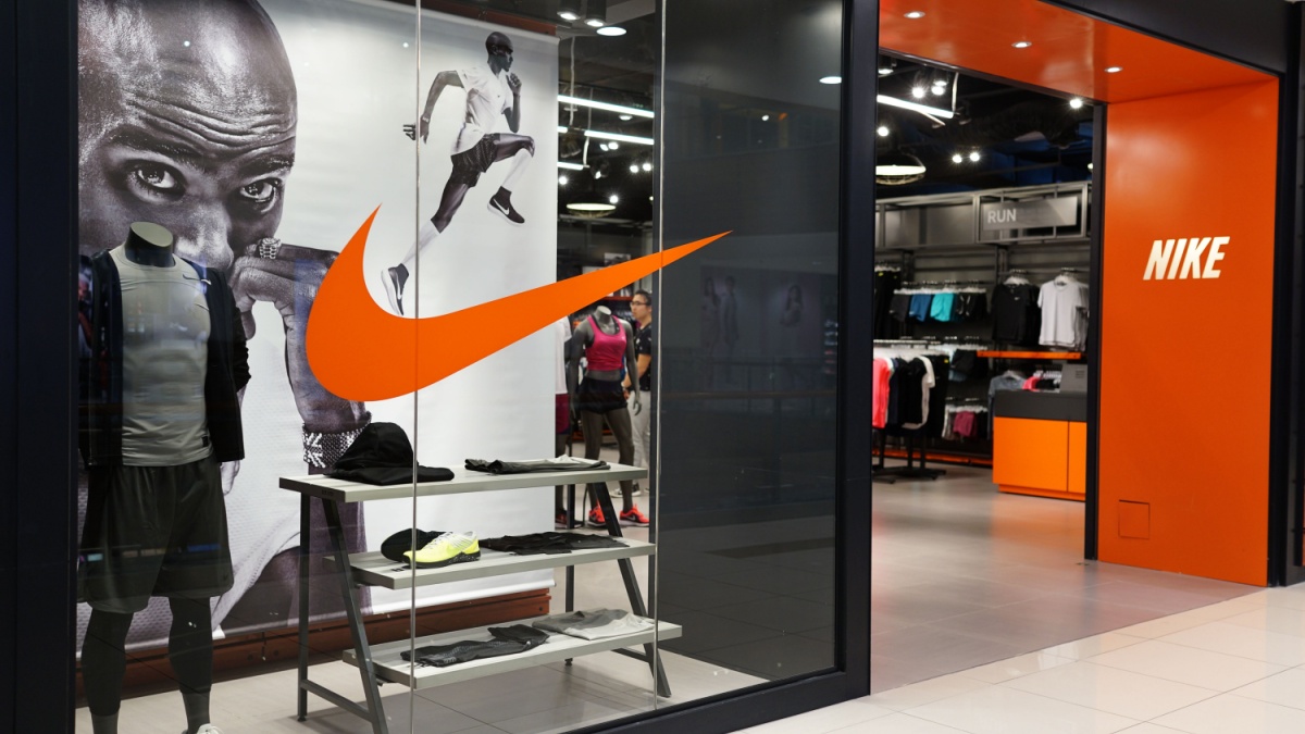 Nike store front in shopping mall. Nike is an American multinational corporation that design, manufacturing, marketing and sales athletic shoes and apparel.
