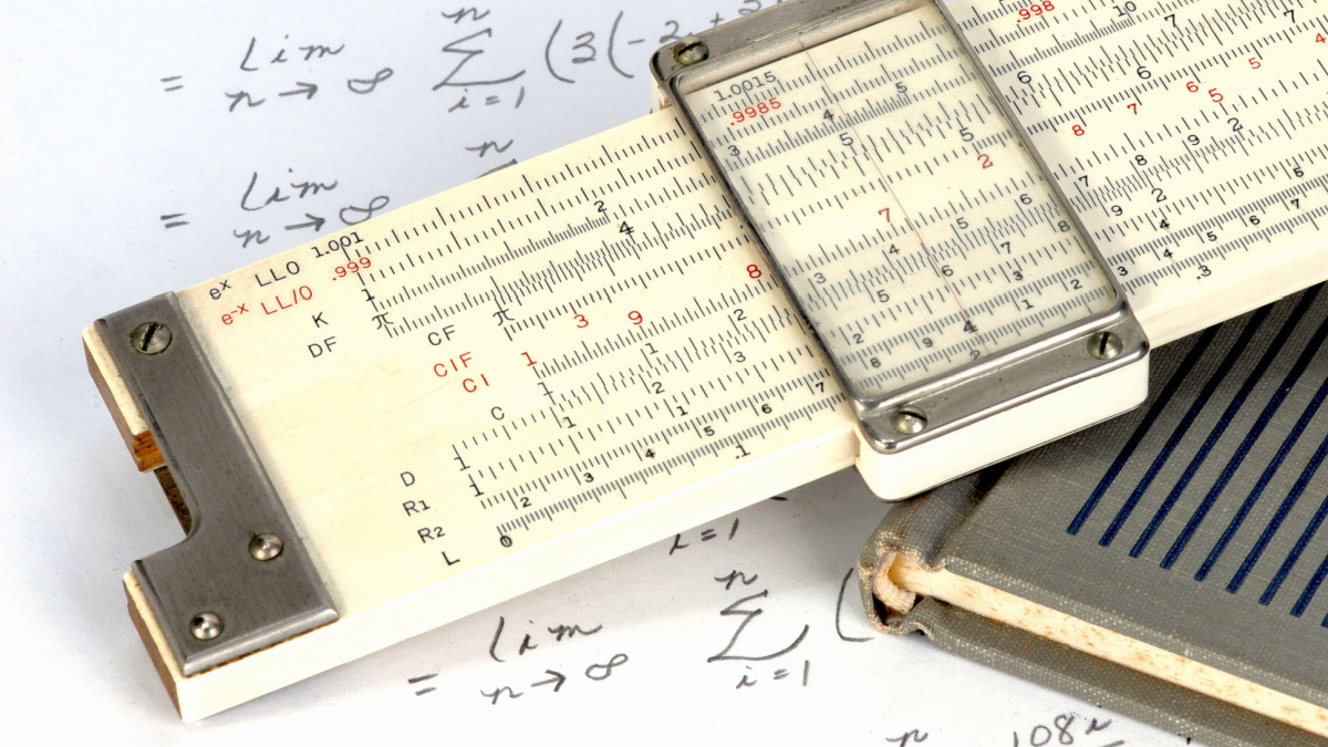 Slide rule close up with work sheet