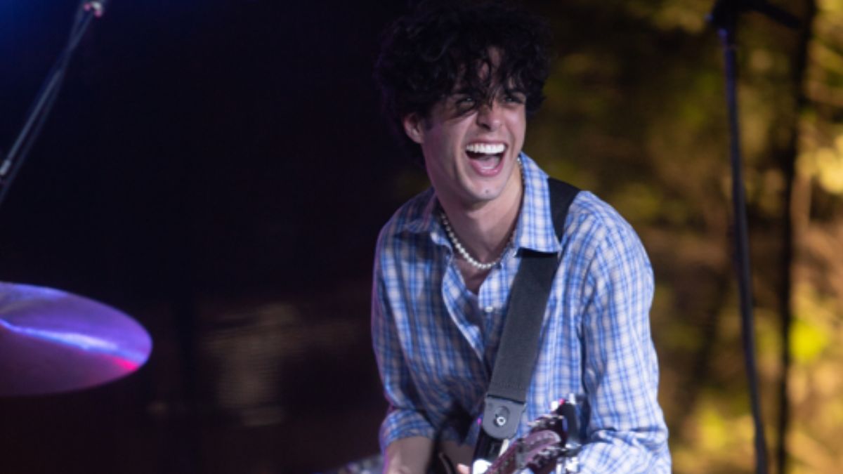 Brightshade Music Festival. Stephen Sanchez performs with guitar smiling at the crowd.