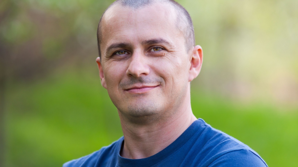 Closeup portrait of a young man outdoor with selective focus.