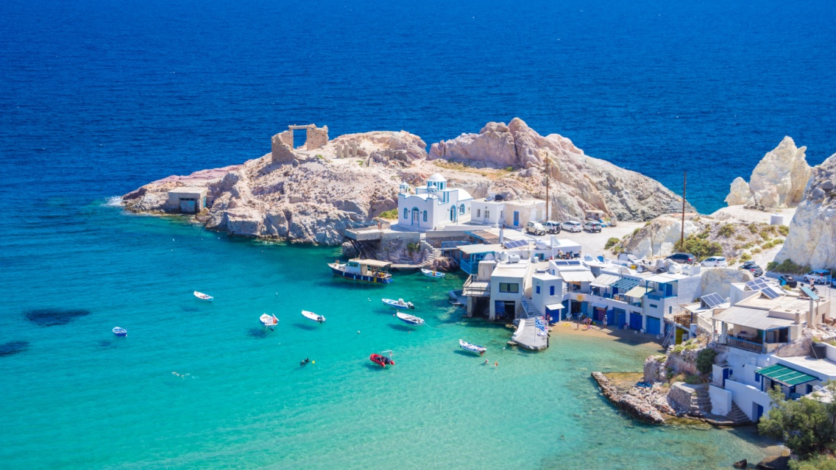 Scenic Firopotamos village (traditional Greek village by the sea, the Cycladic-style) with sirmata - traditional fishermen's houses, Milos island, Cyclades, Greece.