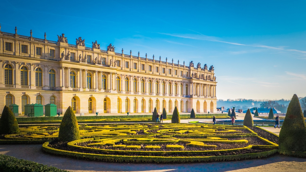 Famous palace Versailles with beautiful gardens outdoors near Paris, France. The Palace Versailles was a royal chateau and was added to the UNESCO list of World Heritage Sites.