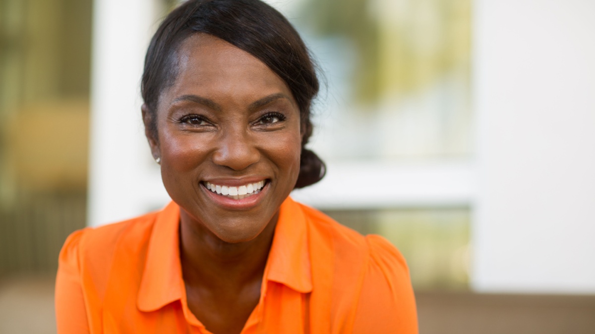 Mature African American woman smiling.