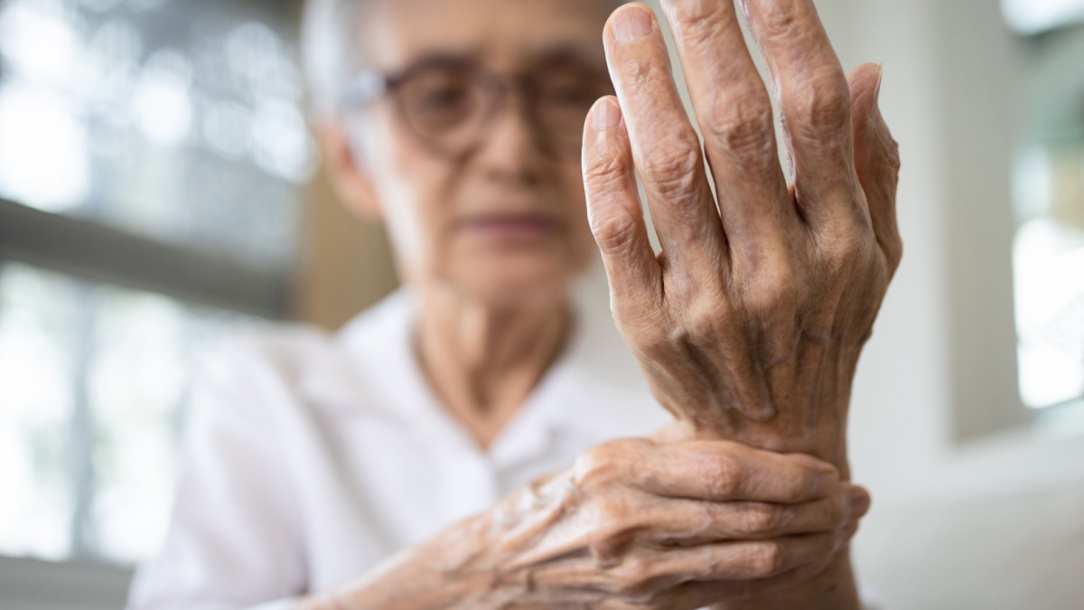 Elderly female patient suffer from numbing pain in hand,numbness fingertip,arthritis inflammation,beriberi or peripheral neuropathies,senior woman massage her hand with wrist pain,rheumatoid arthritis