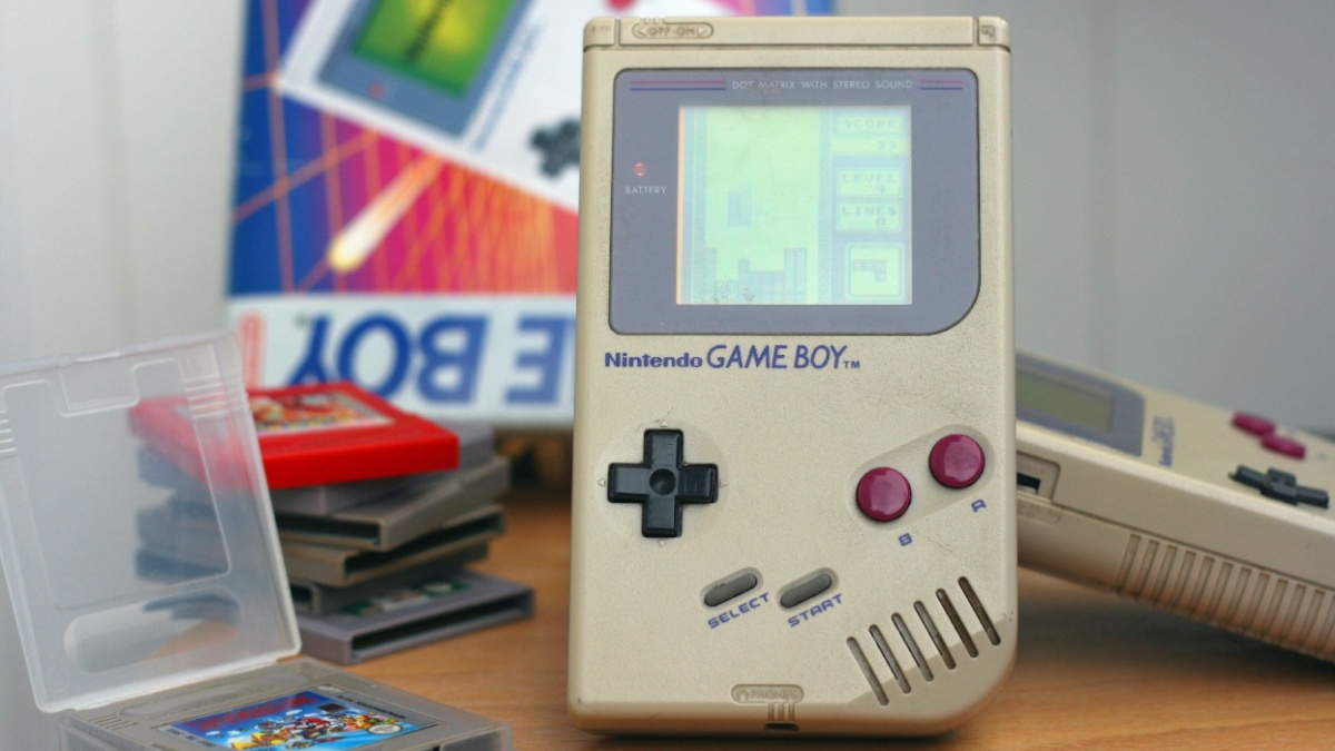 Photo of an original Nintendo handheld video game device Game boy (1989) with Tetris game playing.Showing obvious signs of longtime use.