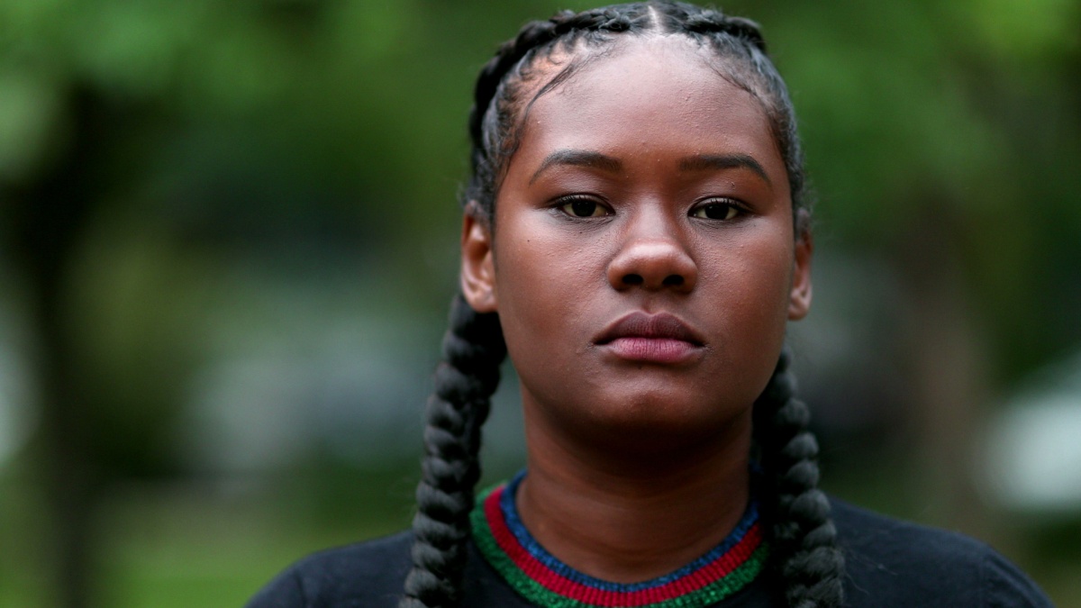 Determined confident young black woman looking at camera.