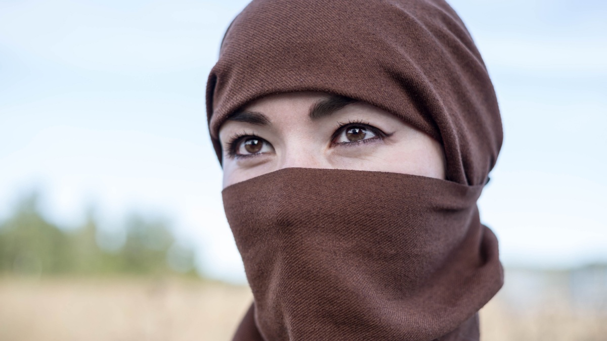 An Afghan woman in a hijab, close-up. The seizure of power. The Taliban.
