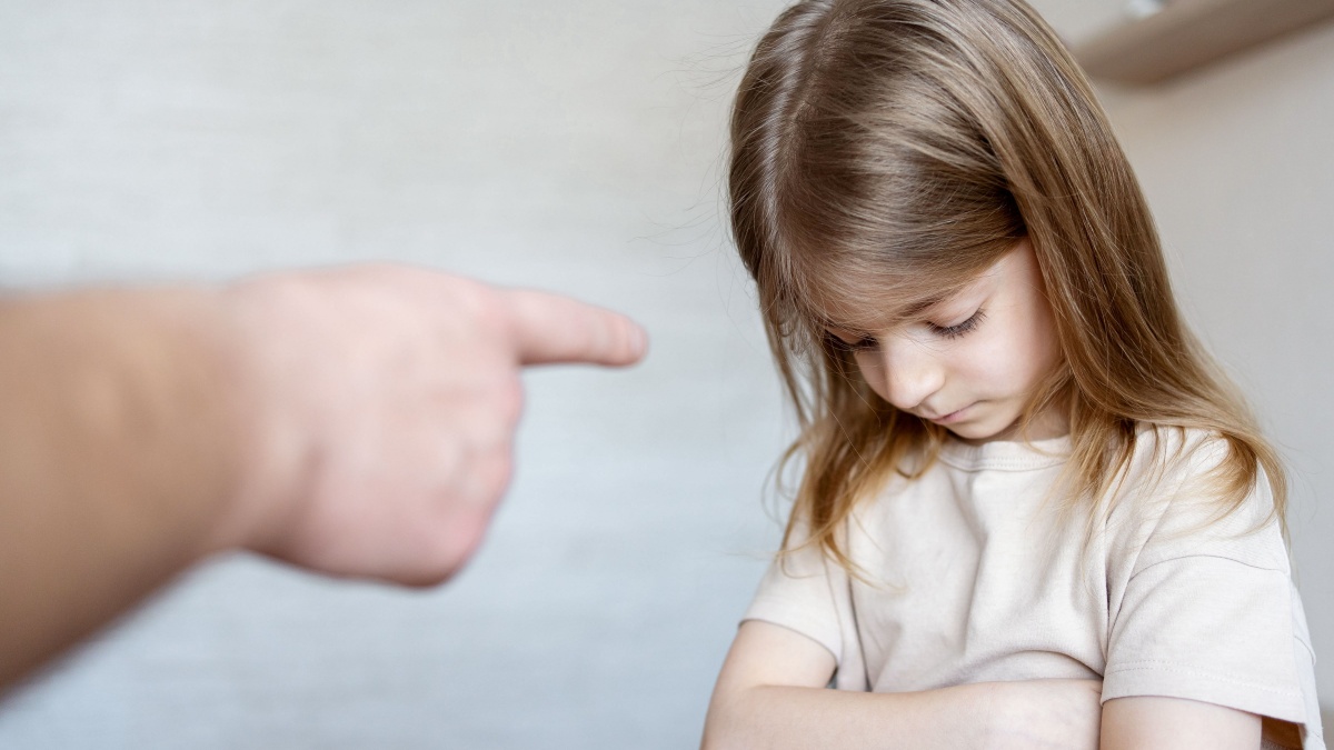 Violence against children. Father scolds and threaten her child girl. family relationships. Discipline, yelling, spanking concept.