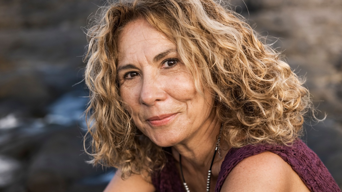 portrait of mature woman with latin features smiling.