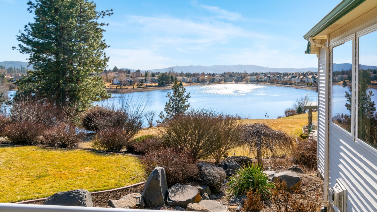 Spokane Valley, Washington, USA - March 26 2023: View from the deck of a waterfront luxury home of Shelley Lake, a natural lake surrounded by community homes in the suburbs of Spokane, Washington.