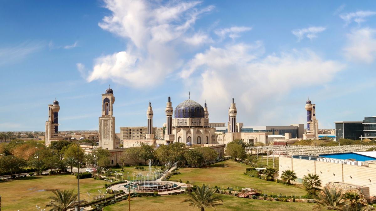 Umm Al-Tabbul Mosque In Baghdad Iraq with beautiful cloud blue sky