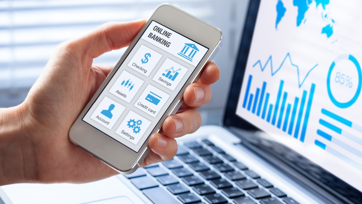 Online banking app on a mobile phone screen with a business person using finance and bank on internet