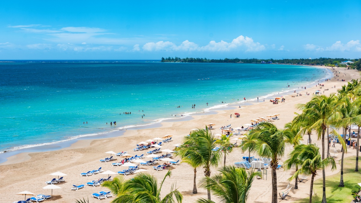 Puerto Rico beach travel vacation landscape background. Isla Verde resort in San Juan, famous tourist cruise ship destination in the Caribbean.