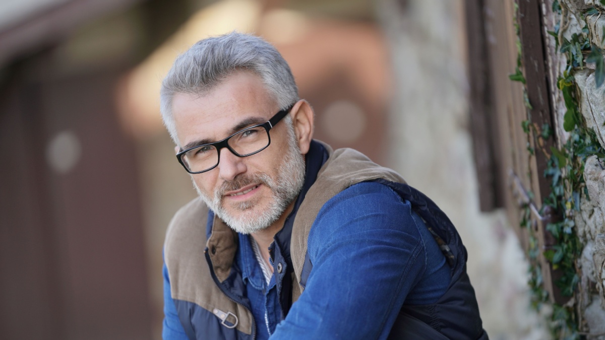 Portrait of mature man in countryside, farming life.