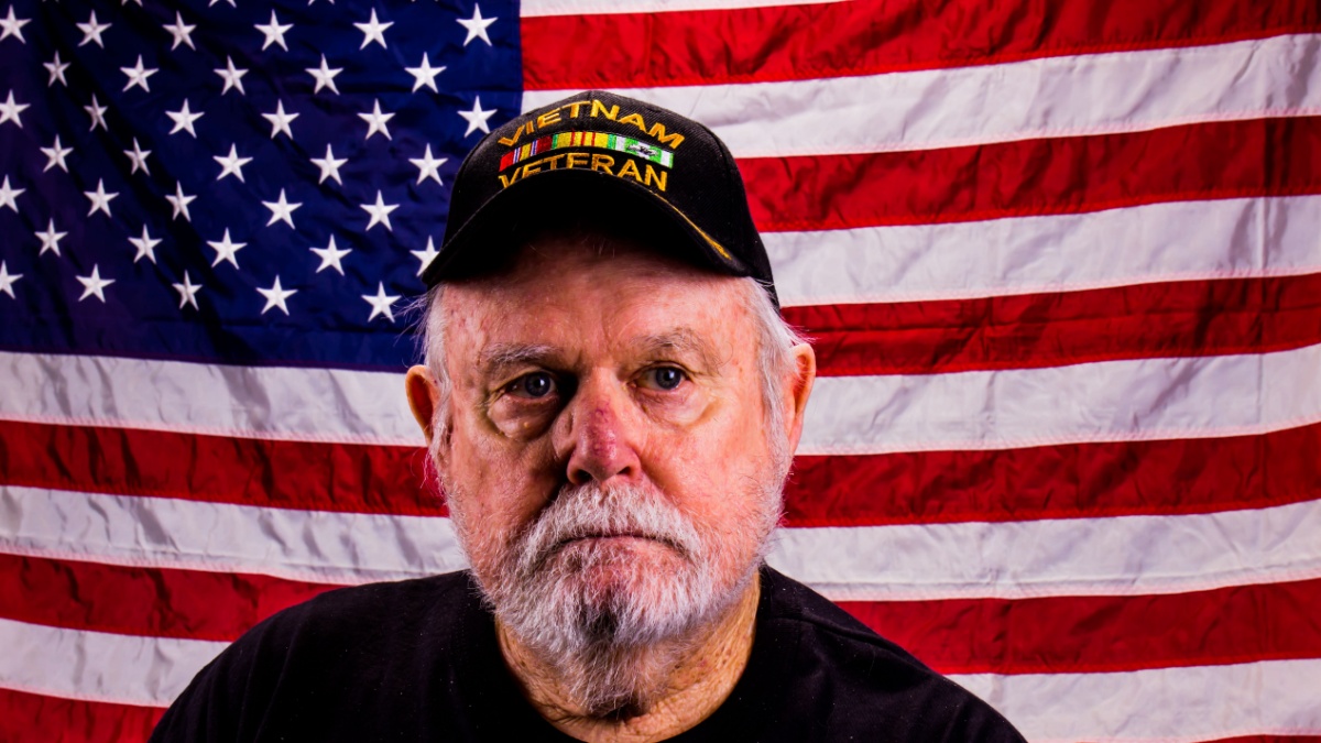 Vietnam Vet Looking Away From Camera With A Lost Look.