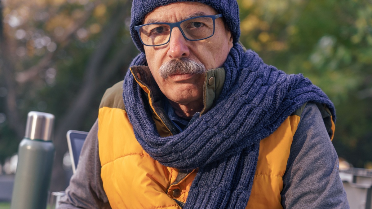 Senior Man Resting on a Table in Autumn Nature SH