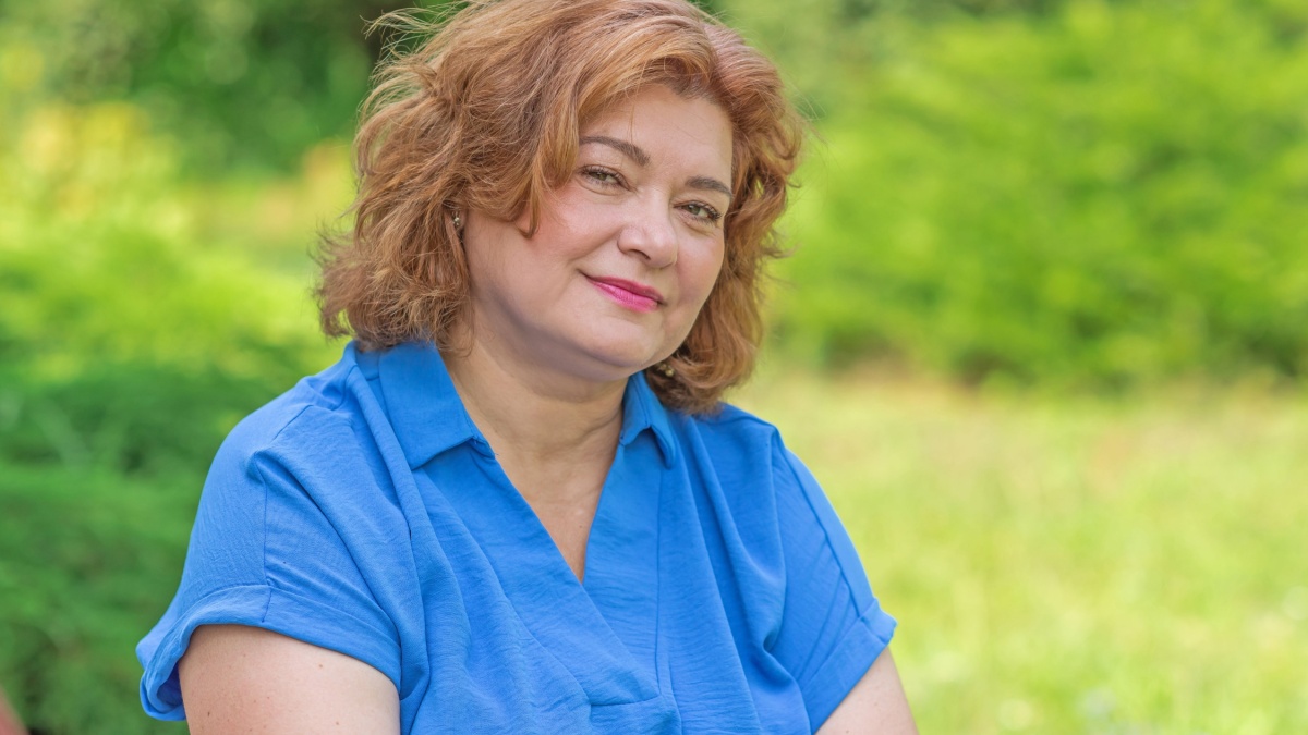 Plus size lady at vacation in blue suit. Holidays and enjoy the life, concept of mature women life, Body positive.