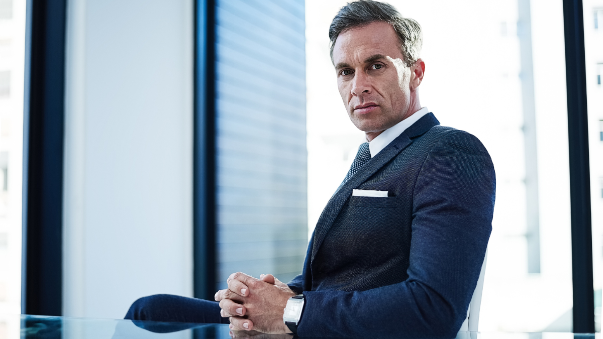 Mature, businessman and portrait with confidence in boardroom for corporate management or business at office. Serious man, executive or company CEO with suit for legal advice or help at workplace.